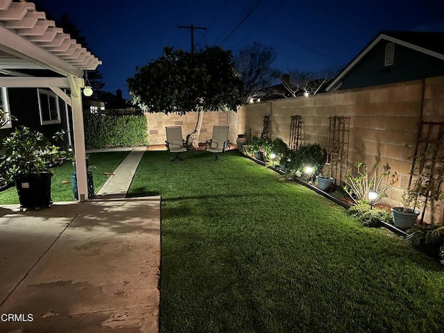1350 Elder St, Oxnard, CA 93036 - yard at twilight featuring a fenced backyard and a patio area