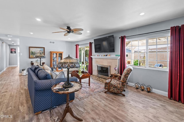 1350 Elder St, Oxnard, CA 93036 - living area with a tile fireplace, a ceiling fan, wood finished floors, and recessed lighting