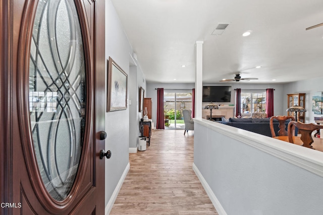 1350 Elder St, Oxnard, CA 93036 - foyer entrance with a ceiling fan, light wood finished floors, recessed lighting, and a fireplace