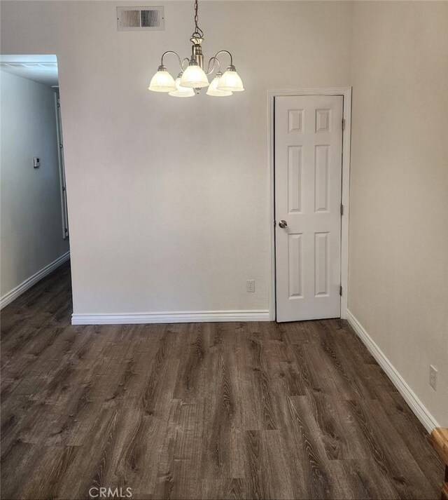 27971 Sarabande Ln Unit 230, Canyon Country, CA 91387 - unfurnished room with dark wood-style flooring and a chandelier
