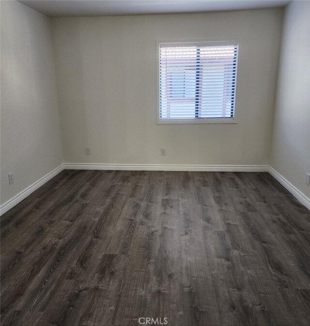 27971 Sarabande Ln Unit 230, Canyon Country, CA 91387 - empty room featuring dark wood finished floors and baseboards