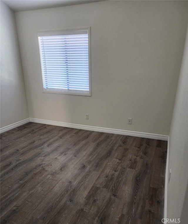 27971 Sarabande Ln Unit 230, Canyon Country, CA 91387 - unfurnished room featuring dark wood-type flooring and baseboards