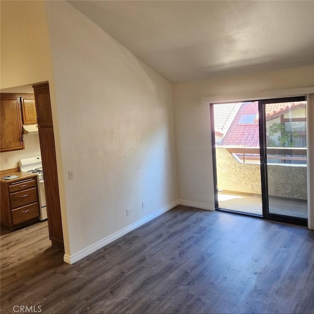 27971 Sarabande Ln Unit 230, Canyon Country, CA 91387 - empty room with dark wood-style flooring and lofted ceiling