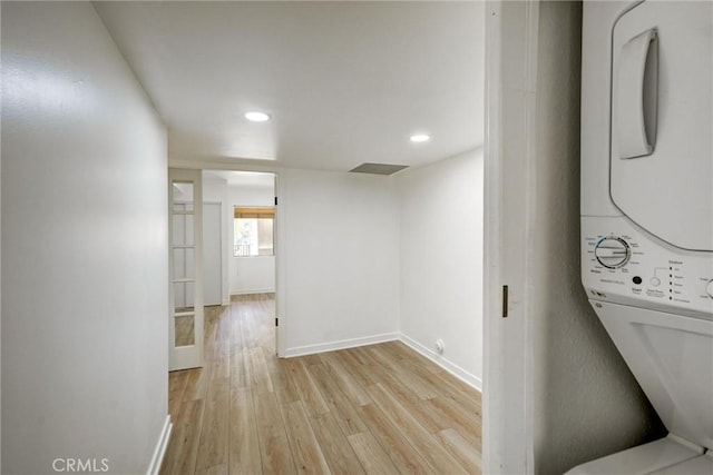 23391 Park Sorrento Unit 62, Calabasas, CA 91302 - corridor with estacked washer and dryer, light wood finished floors, baseboards, and recessed lighting