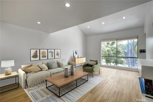 23391 Park Sorrento Unit 62, Calabasas, CA 91302 - living area featuring light wood-style floors, recessed lighting, and vaulted ceiling