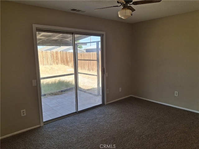 1260 Mirage Dr, Barstow, CA 92311 - empty room featuring dark carpet, ceiling fan, and baseboards