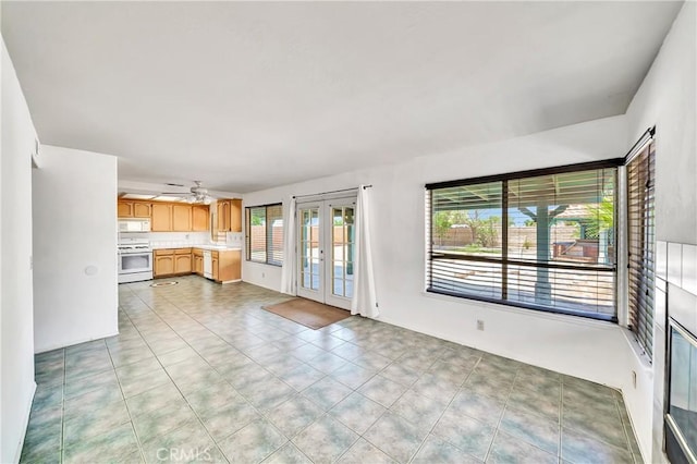 3065 Sabre St, Rosamond, CA 93560 - unfurnished living room featuring french doors and a ceiling fan