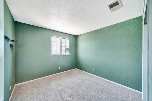 3065 Sabre St, Rosamond, CA 93560 - carpeted empty room with a textured ceiling, baseboards, and a textured wall