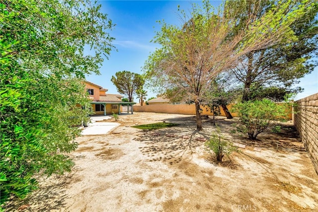 3065 Sabre St, Rosamond, CA 93560 - fenced backyard with a patio area