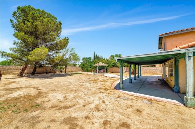 3065 Sabre St, Rosamond, CA 93560 - fenced backyard featuring a gazebo and a patio area
