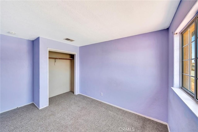 3065 Sabre St, Rosamond, CA 93560 - unfurnished bedroom with carpet flooring, a closet, and baseboards