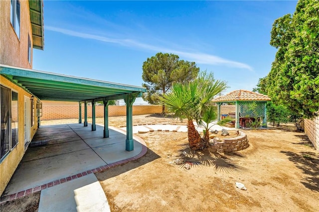 3065 Sabre St, Rosamond, CA 93560 - fenced backyard with a gazebo and a patio area