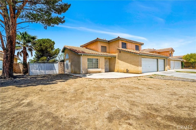 3065 Sabre St, Rosamond, CA 93560 - view of front facade with concrete driveway, a garage, stucco siding, and a tile roof