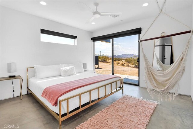 64177 Sullivan Rd, Joshua Tree, CA 92252 - bedroom with access to exterior, concrete flooring, a mountain view, recessed lighting, and a ceiling fan