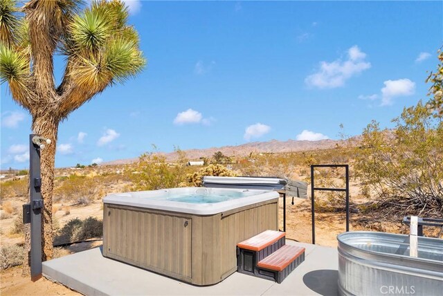 64177 Sullivan Rd, Joshua Tree, CA 92252 - view of patio featuring a hot tub and a mountain view
