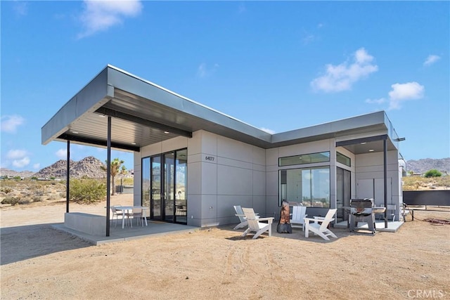 64177 Sullivan Rd, Joshua Tree, CA 92252 - rear view of house with a patio and a mountain view