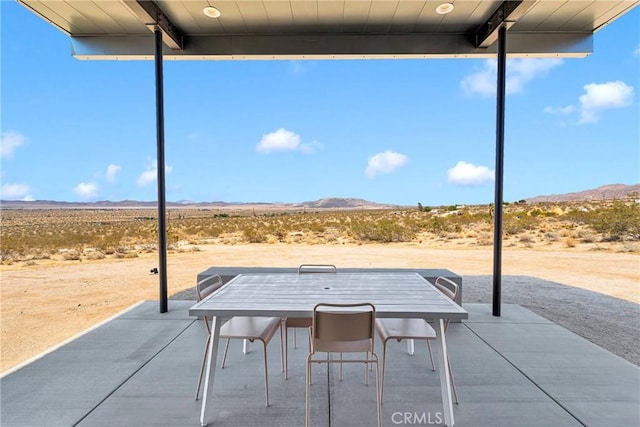 64177 Sullivan Rd, Joshua Tree, CA 92252 - view of patio / terrace featuring a mountain view, a desert view, outdoor dining area, and a view of countryside