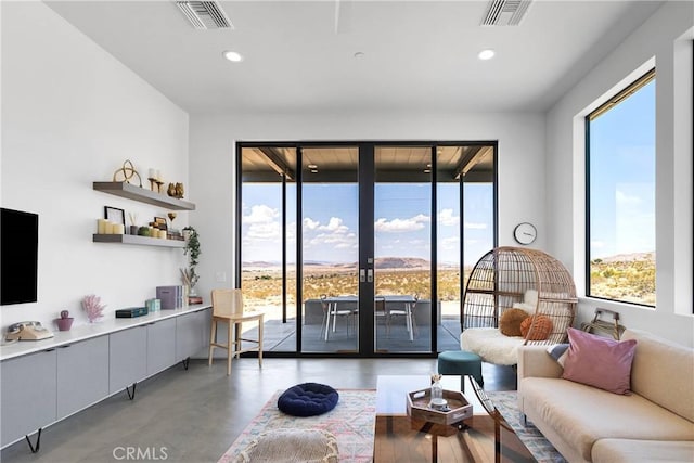 64177 Sullivan Rd, Joshua Tree, CA 92252 - living area with healthy amount of natural light, concrete floors, recessed lighting, and french doors