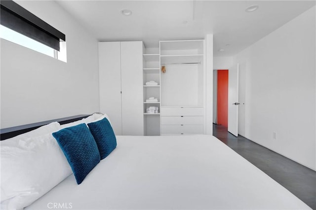 64121 Sullivan Rd, Joshua Tree, CA 92252 - bedroom featuring concrete flooring, a closet, and recessed lighting