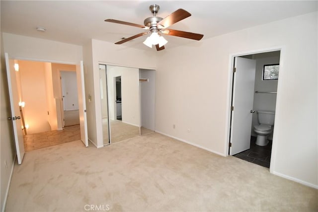 1069 Donahue St, San Diego, CA 92110 - unfurnished bedroom featuring light carpet, a closet, ensuite bath, and a ceiling fan