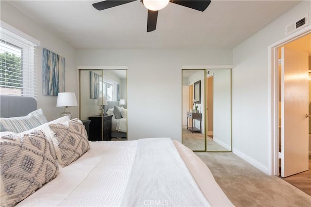19847 Coventry Ln, Huntington Beach, CA 92646 - bedroom with multiple closets, multiple windows, carpet floors, and ceiling fan