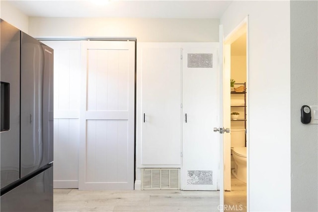 19847 Coventry Ln, Huntington Beach, CA 92646 - unfurnished bedroom with stainless steel refrigerator with ice dispenser, light wood-style floors, and a closet