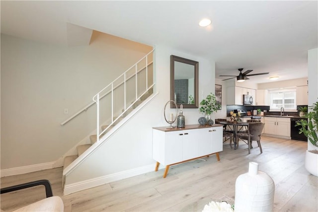 19847 Coventry Ln, Huntington Beach, CA 92646 - staircase with wood finished floors and ceiling fan