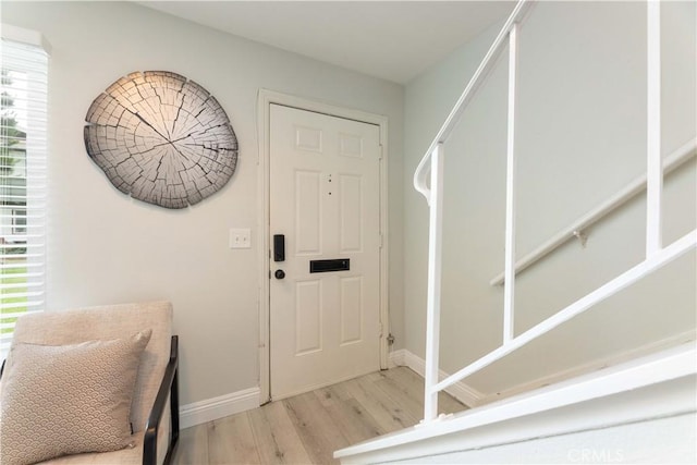 19847 Coventry Ln, Huntington Beach, CA 92646 - foyer entrance featuring wood finished floors, healthy amount of natural light, and stairway