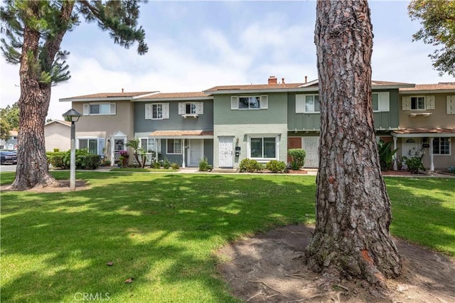 19847 Coventry Ln, Huntington Beach, CA 92646 - view of property with a front yard and a chimney