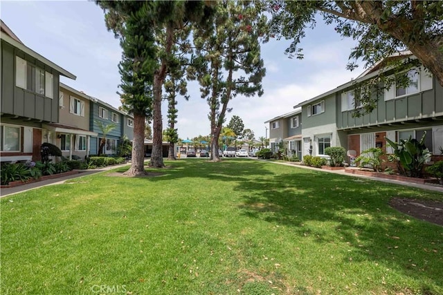 19847 Coventry Ln, Huntington Beach, CA 92646 - surrounding community featuring a residential view and a lawn