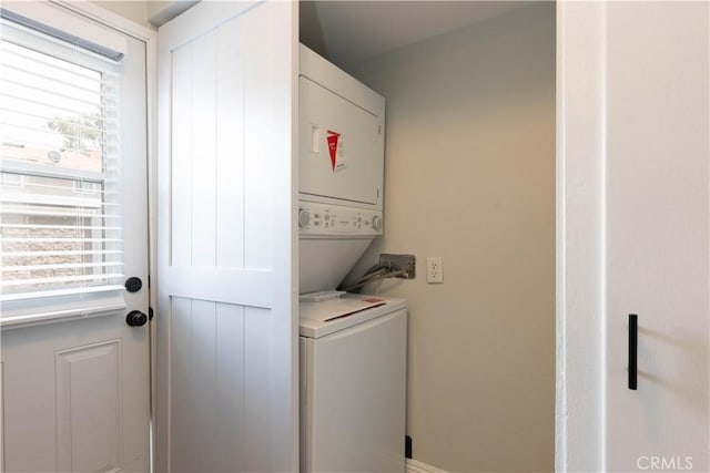 19847 Coventry Ln, Huntington Beach, CA 92646 - laundry area featuring stacked washer and clothes dryer and plenty of natural light