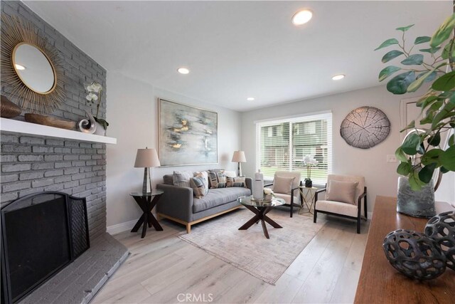 19847 Coventry Ln, Huntington Beach, CA 92646 - living area featuring wood finished floors, a fireplace, and recessed lighting