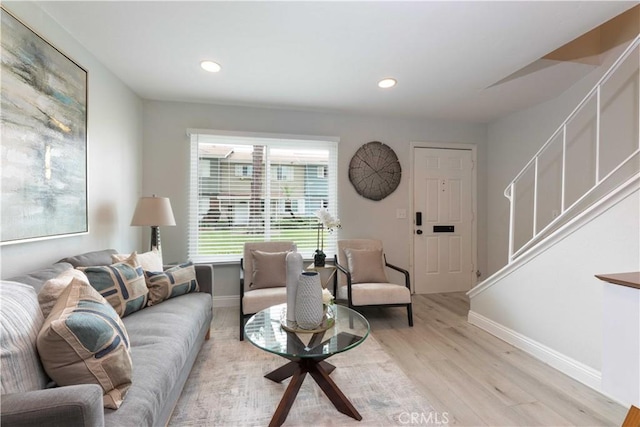 19847 Coventry Ln, Huntington Beach, CA 92646 - living room featuring light wood finished floors, recessed lighting, and stairway