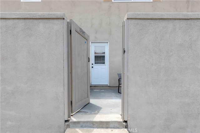 19847 Coventry Ln, Huntington Beach, CA 92646 - doorway to property featuring stucco siding