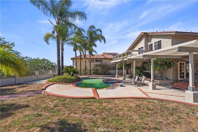 20905 Running Branch Rd, Diamond Bar, CA 91765 - view of yard featuring a patio, a balcony, a pool with connected hot tub, and french doors