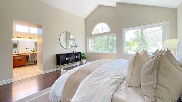 4 Salerno, Irvine, CA 92614 - bedroom featuring light wood-style flooring, vaulted ceiling, and ensuite bath