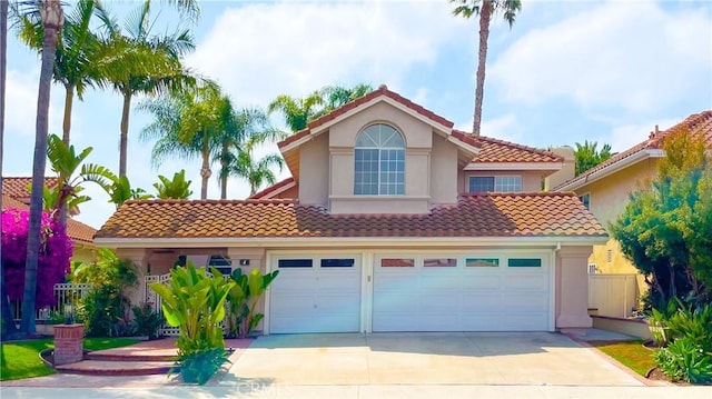 4 Salerno, Irvine, CA 92614 - mediterranean / spanish house with a tiled roof, concrete driveway, stucco siding, and a garage