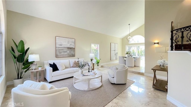 4 Salerno, Irvine, CA 92614 - living room featuring high vaulted ceiling, marble finish flooring, and a chandelier