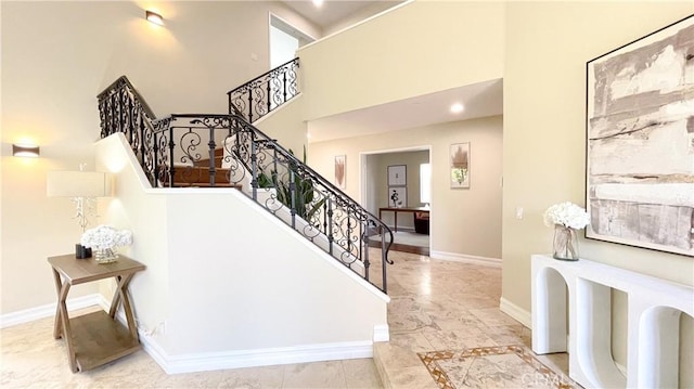 4 Salerno, Irvine, CA 92614 - stairway with marble look tiles and a towering ceiling