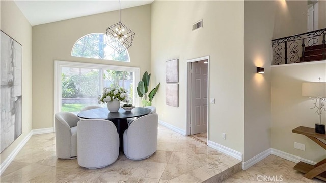 4 Salerno, Irvine, CA 92614 - dining area with a chandelier, light marble finish flooring, and a high ceiling