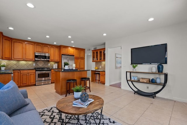 21905 Grovepark Dr, Saugus, CA 91350 - living room featuring light tile patterned floors, recessed lighting, and baseboards