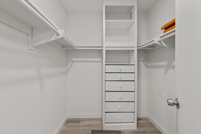 21905 Grovepark Dr, Saugus, CA 91350 - spacious closet with wood finished floors