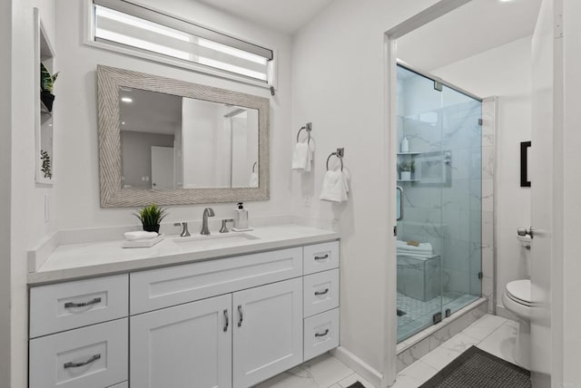 21905 Grovepark Dr, Saugus, CA 91350 - full bath featuring marble look tiles, a marble finish shower, vanity, toilet, and baseboards