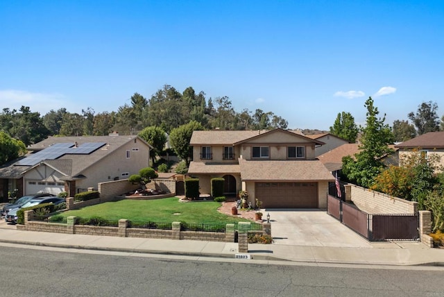21905 Grovepark Dr, Saugus, CA 91350 - traditional-style house featuring concrete driveway, an attached garage, a residential view, stucco siding, and a gate