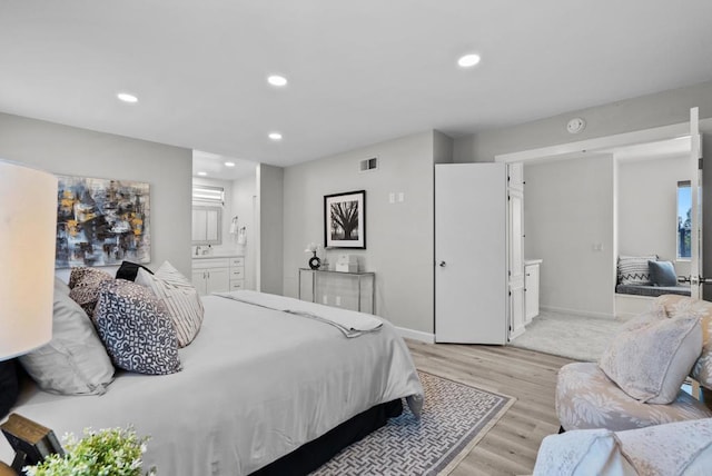 21905 Grovepark Dr, Saugus, CA 91350 - bedroom featuring light wood-style floors, recessed lighting, and ensuite bathroom