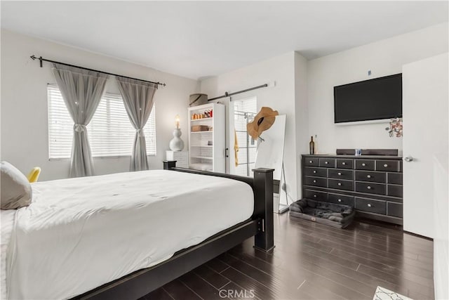 534 E Hazel St Unit 5, Inglewood, CA 90302 - bedroom with wood finished floors, a barn door, and multiple windows
