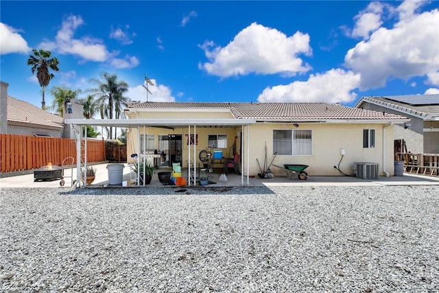 24880 Balestrieri Rd, Hemet, CA 92544 - back of house with an outdoor fire pit, a patio area, a tiled roof, central AC, and stucco siding