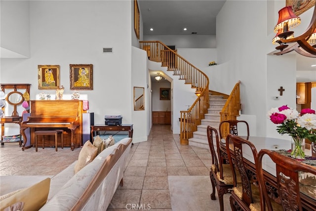22440 Skylake Pl, Saugus, CA 91390 - living room with a high ceiling, stairs, baseboards, and recessed lighting