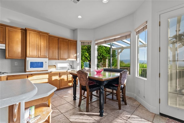 22440 Skylake Pl, Saugus, CA 91390 - dining area with recessed lighting and light tile patterned floors