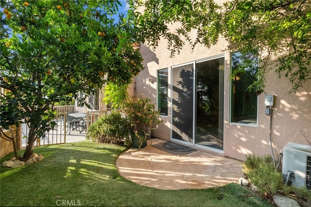 22440 Skylake Pl, Saugus, CA 91390 - view of exterior entry with stucco siding, a patio, and central AC unit